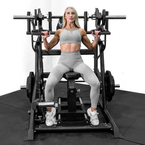 Female User of Freedom Series Armada Plate Loaded Shoulder Press by Bolt Fitness