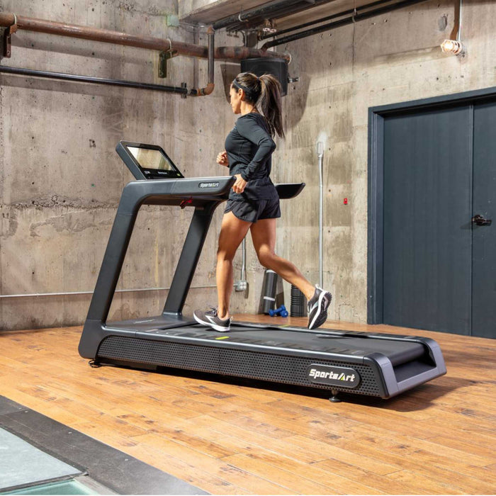 SportsArt T674L-16 Elite Treadmill female user running