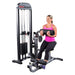 body solid pro select gcab stk ab and back machine woman using roller white background