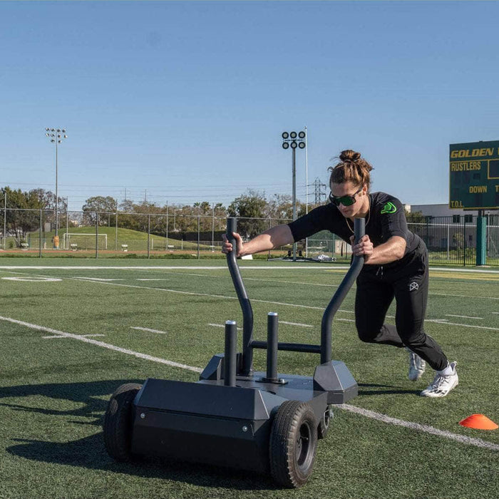 bodykore smart sled woman pushing at football field