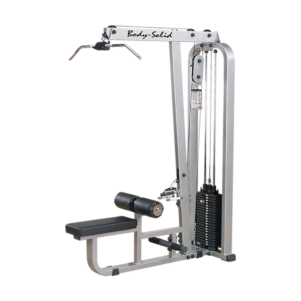 Large man on the lat pulldown machine at the bottom of a rep