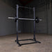 pro clubline spr500 half squat rack corner view with barbell